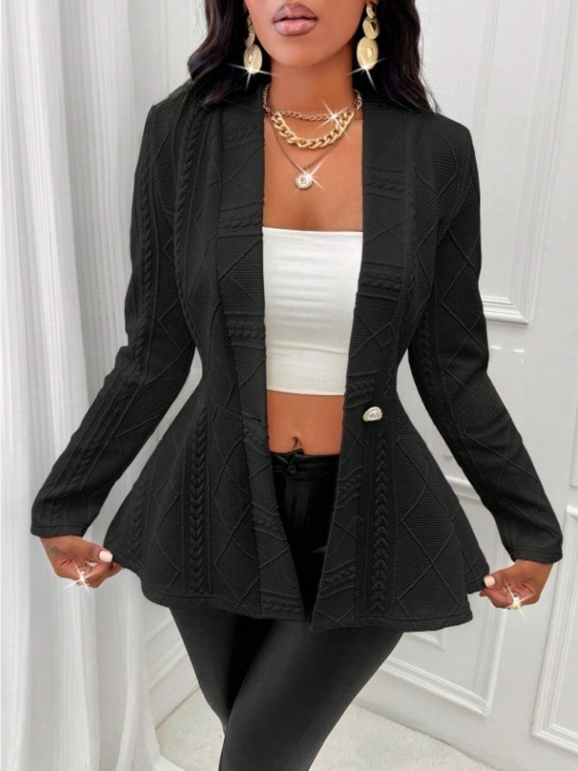 Black textured knit peplum blazer with a single button closure and open front.