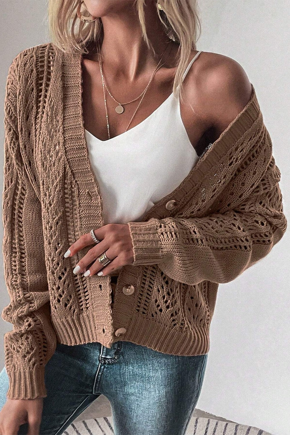 Taupe mesh detail cardigan with button front and open knit pattern.