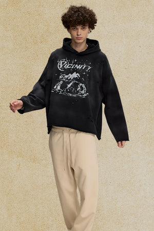Black oversized distressed graphic hoodie with distressed details and a crew neckline.