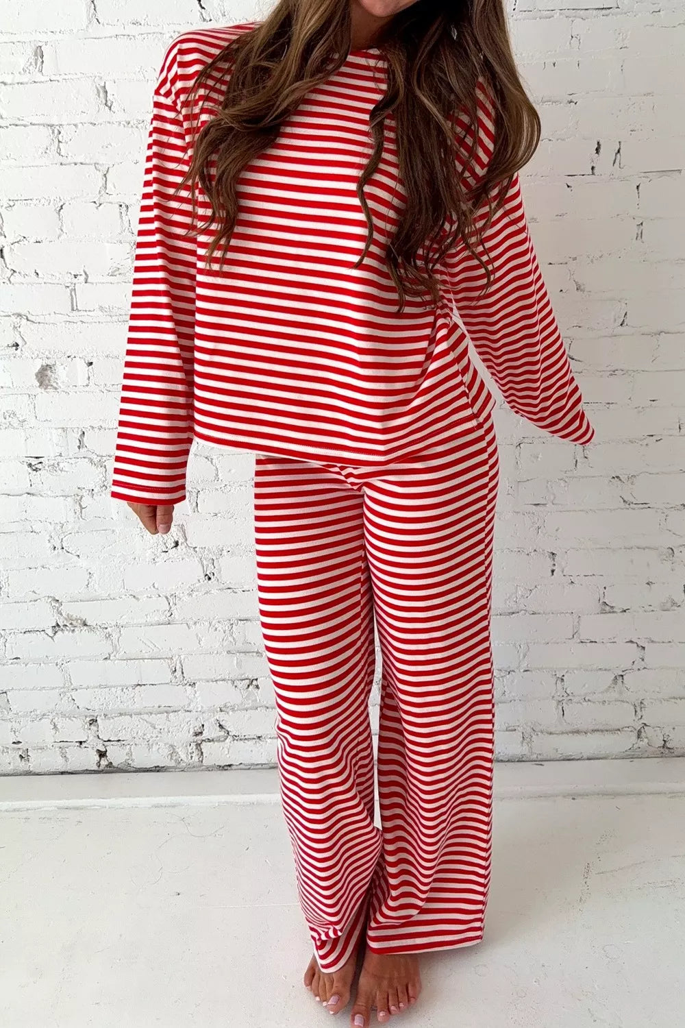 Red and white striped cotton blend loungewear set with long sleeves and wide-leg pants.
