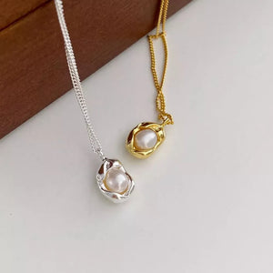 Sterling silver and gold necklaces with lustrous freshwater pearls in organic settings.