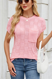 Blush pink knit top with textured squares and a chest pocket.
