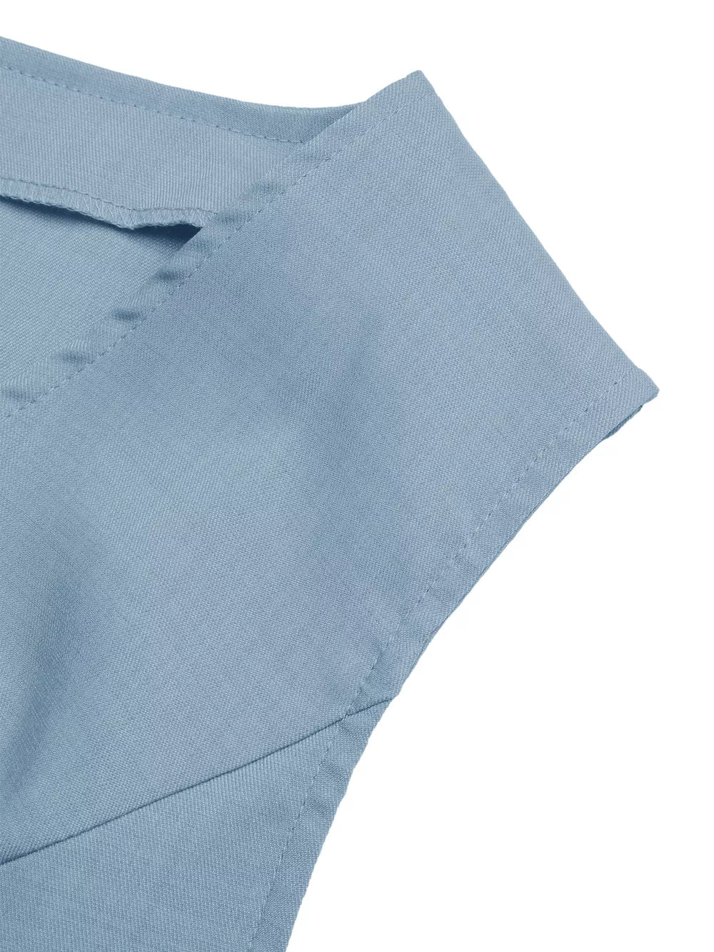 Chic blue buttoned vest detail with tailored collar and stitching.