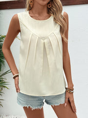 Pleated front sleeveless top in beige with a textured stripe pattern and round neckline.
