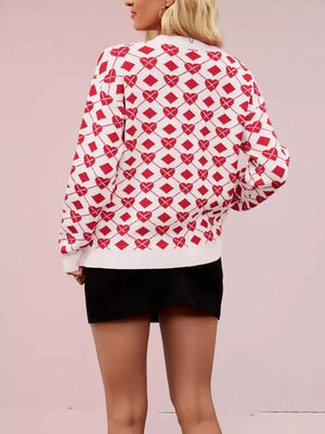 White and red argyle knit sweater with heart details, crew neck, long sleeves.