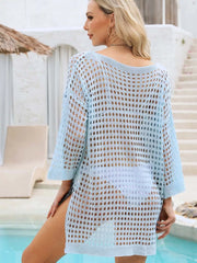 Light blue openwork crochet knit swim cover-up with crew neck and side slits.