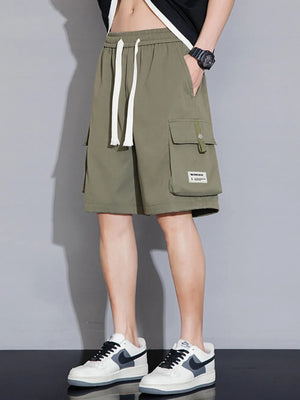 Sage green cargo shorts with drawstring waist and multiple pockets.