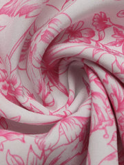 Maternity shirt with pink floral print on white fabric, showing fabric texture and detail.