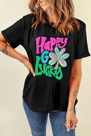 Black graphic tee with rolled sleeves and "Happy Go Lucky" clover design