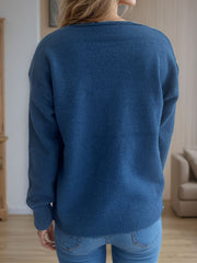 Relaxed-fit V-neck knit sweater in Peacock Blue with ribbed hem and cuffs.