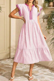 Charming striped midi dress in blush pink with ruffle sleeves and tiered hem.