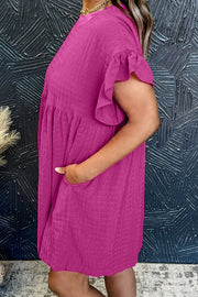 Hot pink textured babydoll dress with ruffle sleeves and pockets.