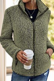 Moss teddy fleece zip-up jacket with stand collar and pockets.