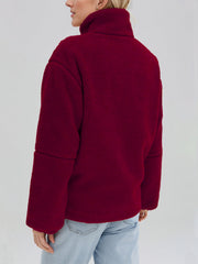 Burgundy sherpa stand-collar jacket with a textured fleece fabric and relaxed fit.
