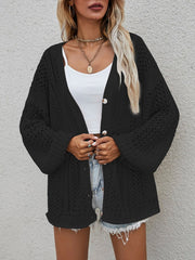 Black open-knit button-down cardigan with balloon sleeves.