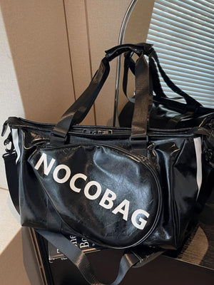 Black leather duffel bag with white NOCGOBAG logo and detachable strap.