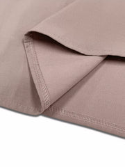Dusty pink lightweight open front cardigan detail showing hem stitching.