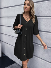 Black button-down mini dress with V-neck and rolled sleeves
