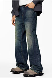 Men's wide-leg blue vintage wash jeans with distressed detail and a relaxed fit.