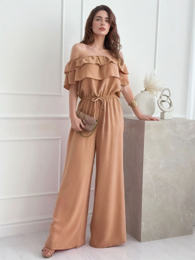 Camel off-the-shoulder jumpsuit with tiered ruffles and wide legs.