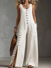 White button-front wide-leg jumpsuit with side pockets and high slits.