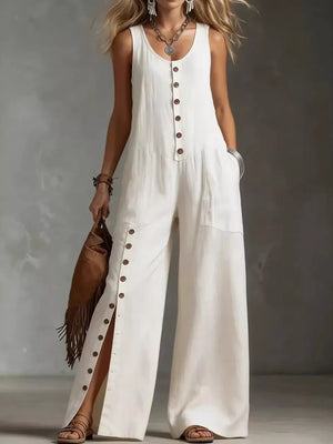 White button-front wide-leg jumpsuit with side pockets and high slits.