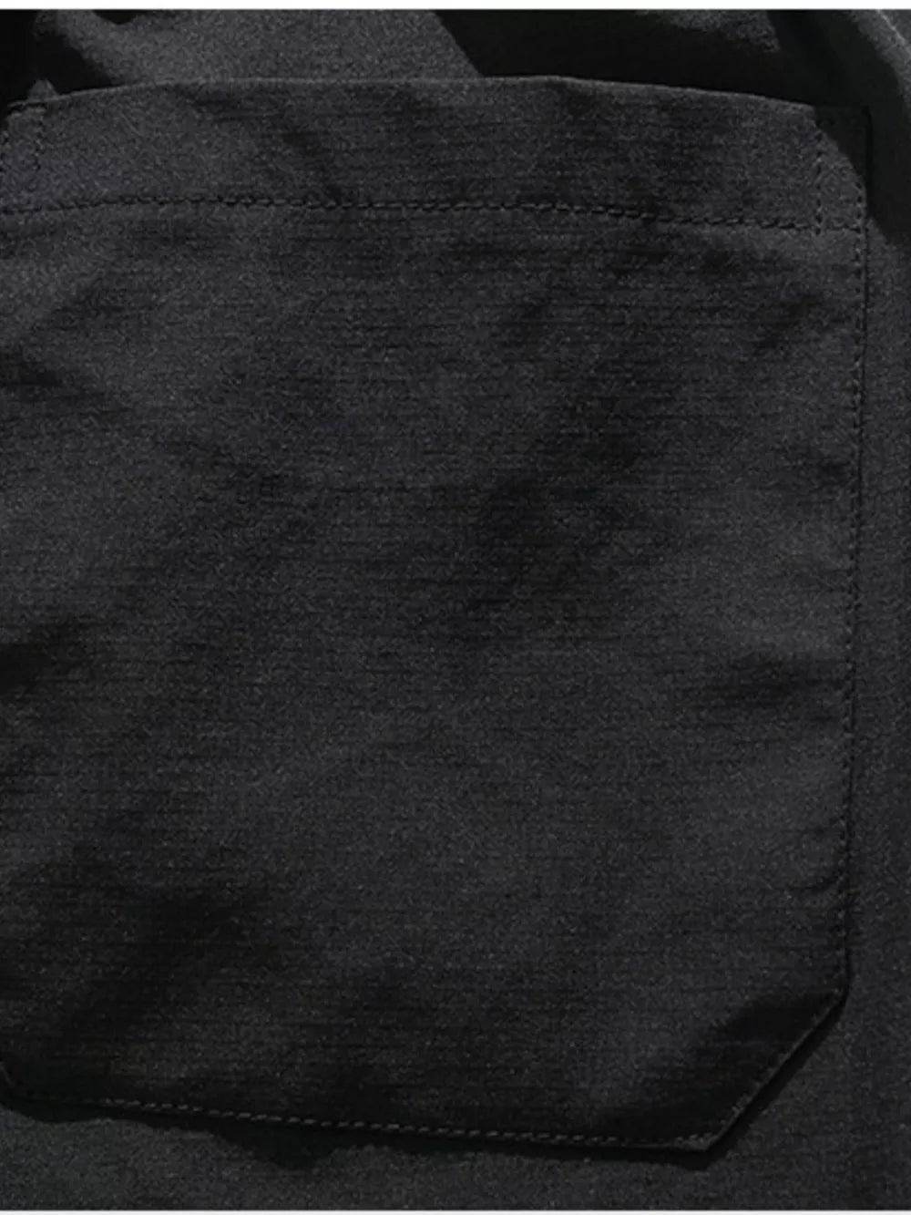 Black cargo capris with a patch pocket and visible stitching detail.
