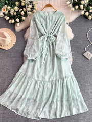 Light Green embroidered tie-waist dress with balloon sleeves and tiered skirt.