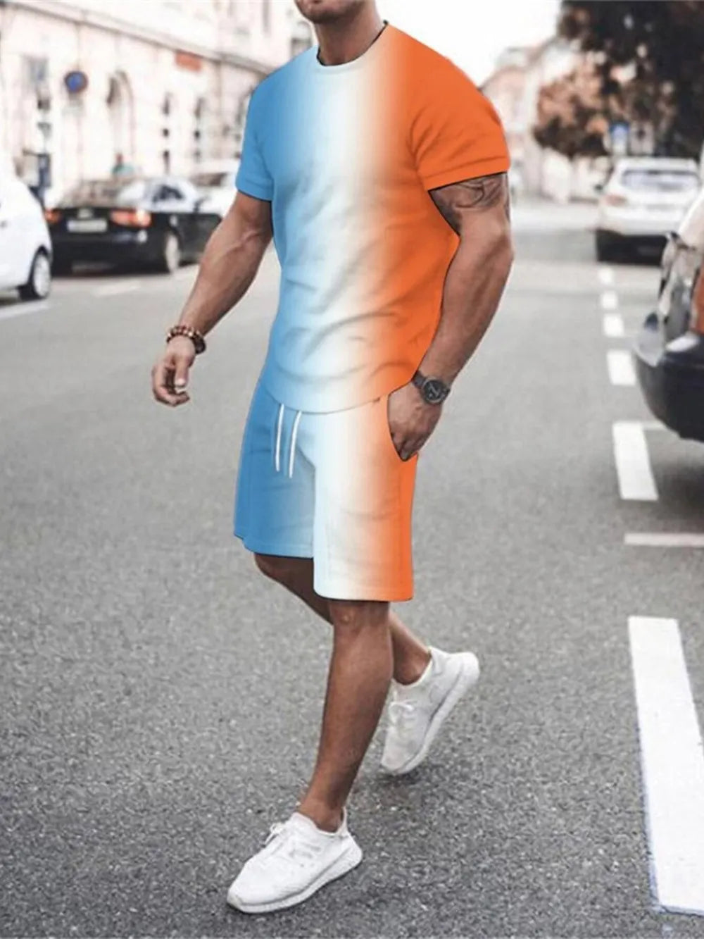 Men's gradient tee and shorts set in orange-red and blue.