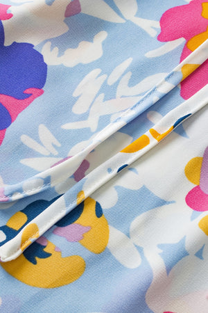 Light blue floral print blouse with dalmatian trim detail