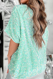 Sequin embellished dolman sleeve top in Gum Leaf green with iridescent sparkle.