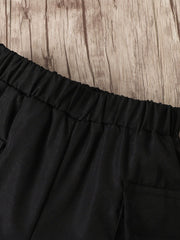 Children's black cargo shorts with elastic waistband and pocket detail.