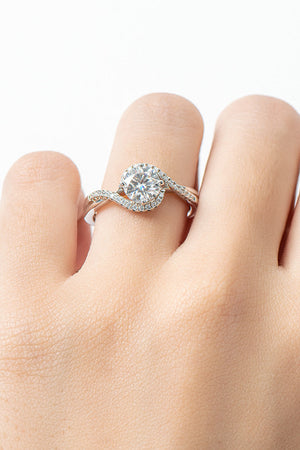 Silver swirl halo moissanite engagement ring with pave band