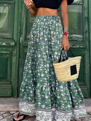 Green floral maxi tiered skirt with a border print and elastic waist.