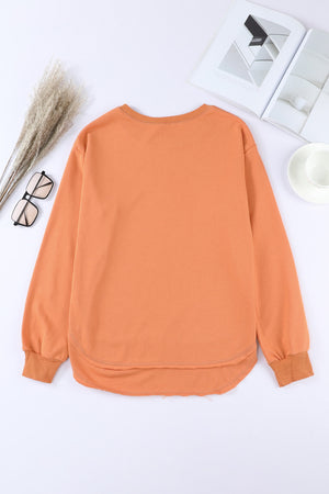 Orange sweatshirt with asymmetric hemline and crew neck