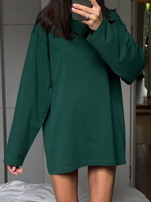 Oversized dark green cotton jersey long sleeve top with crew neck.