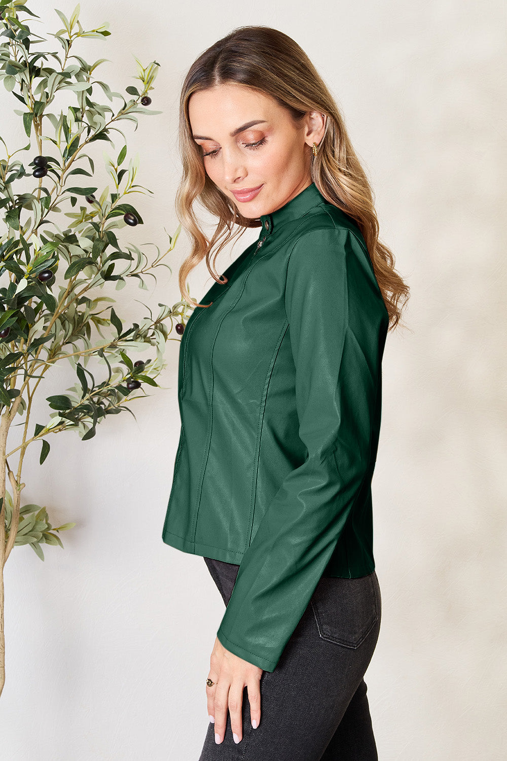 Green faux leather biker jacket with a stand-up collar and zip detail.