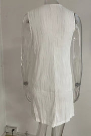 White textured mini dress with V-neck and ring straps, cotton blend fabric.