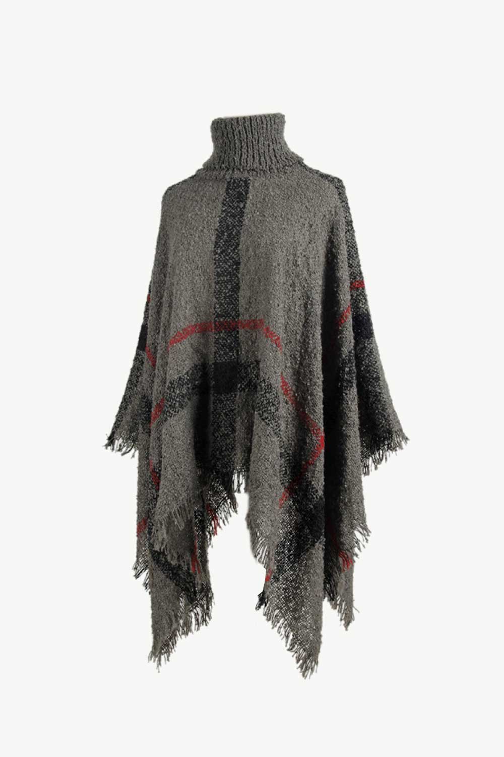 Textured plaid turtleneck cape in charcoal acrylic with fringed hem and red accents.