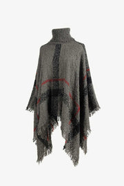 Textured plaid turtleneck cape in charcoal acrylic with fringed hem and red accents.