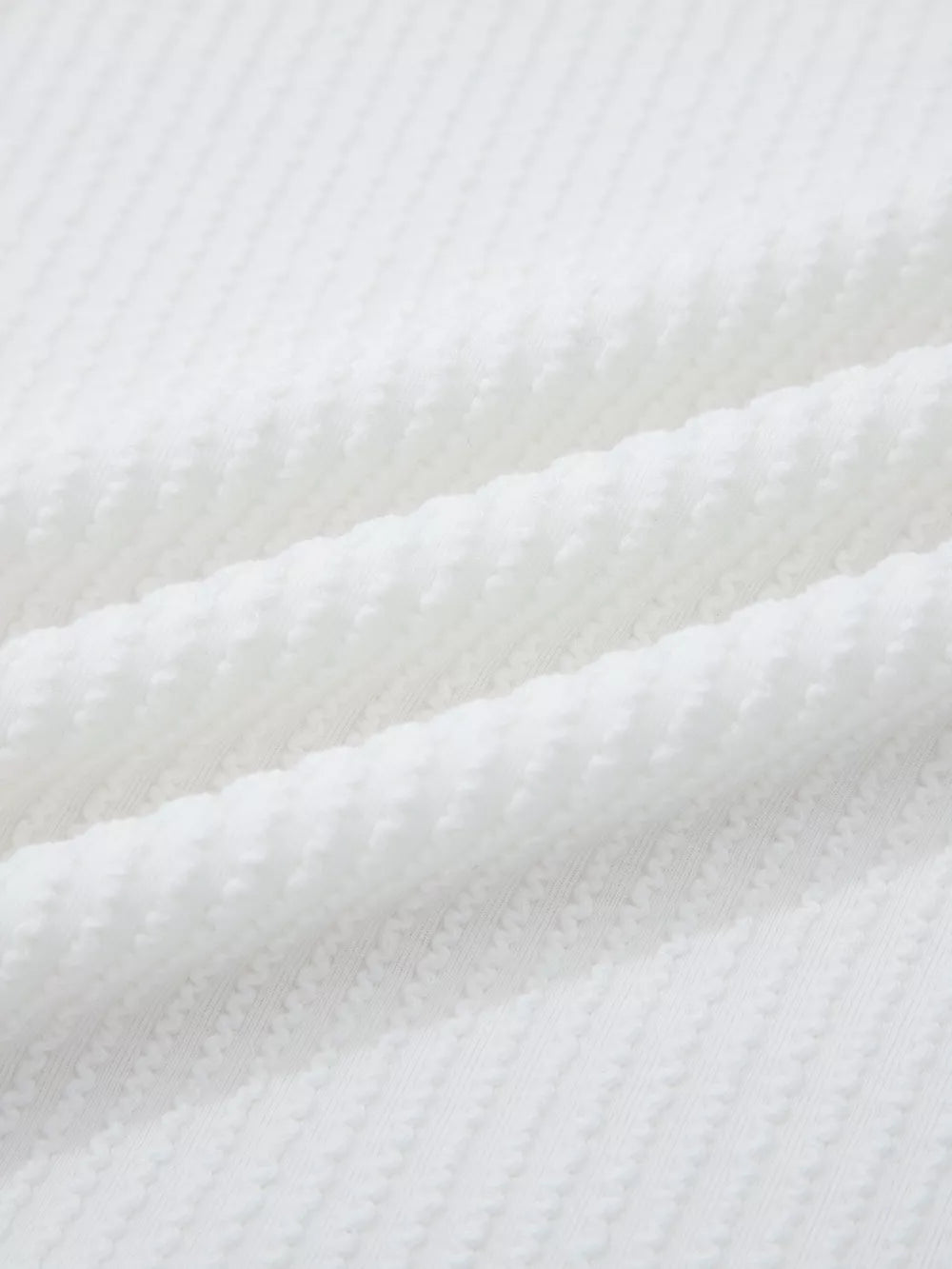 White ribbed maternity t-shirt with textured fabric detail