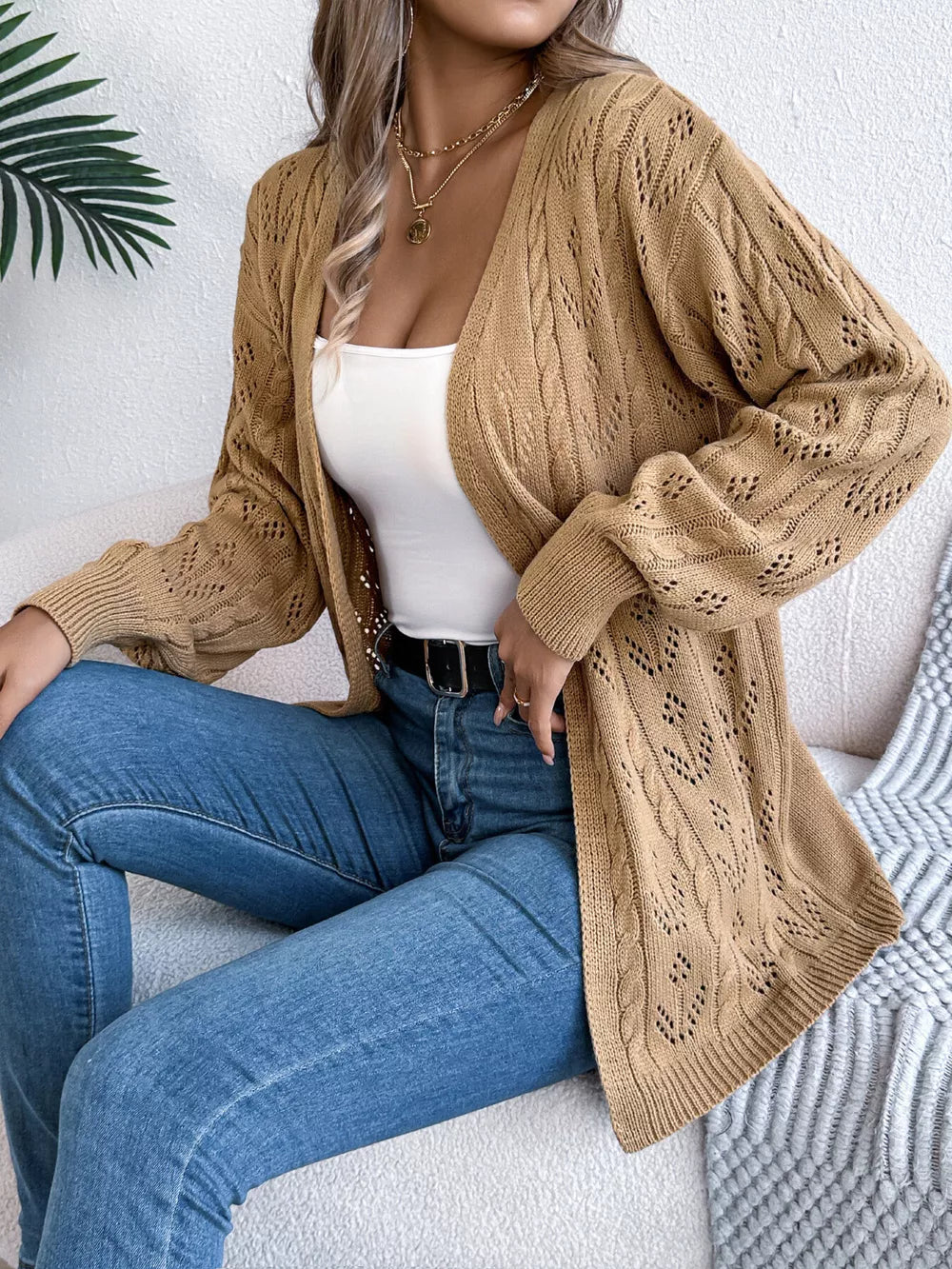 Khaki openwork cable knit long sleeve cardigan with intricate detailing.