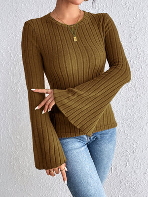 Olive brown ribbed sweater with flared sleeves and a crew neck, styled with jeans.