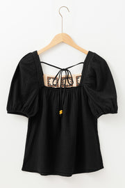 Black gauze puff sleeve blouse with crochet yoke and tie detail