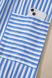 Maternity pants with blue and white stripes and a functional pocket holding a phone.
