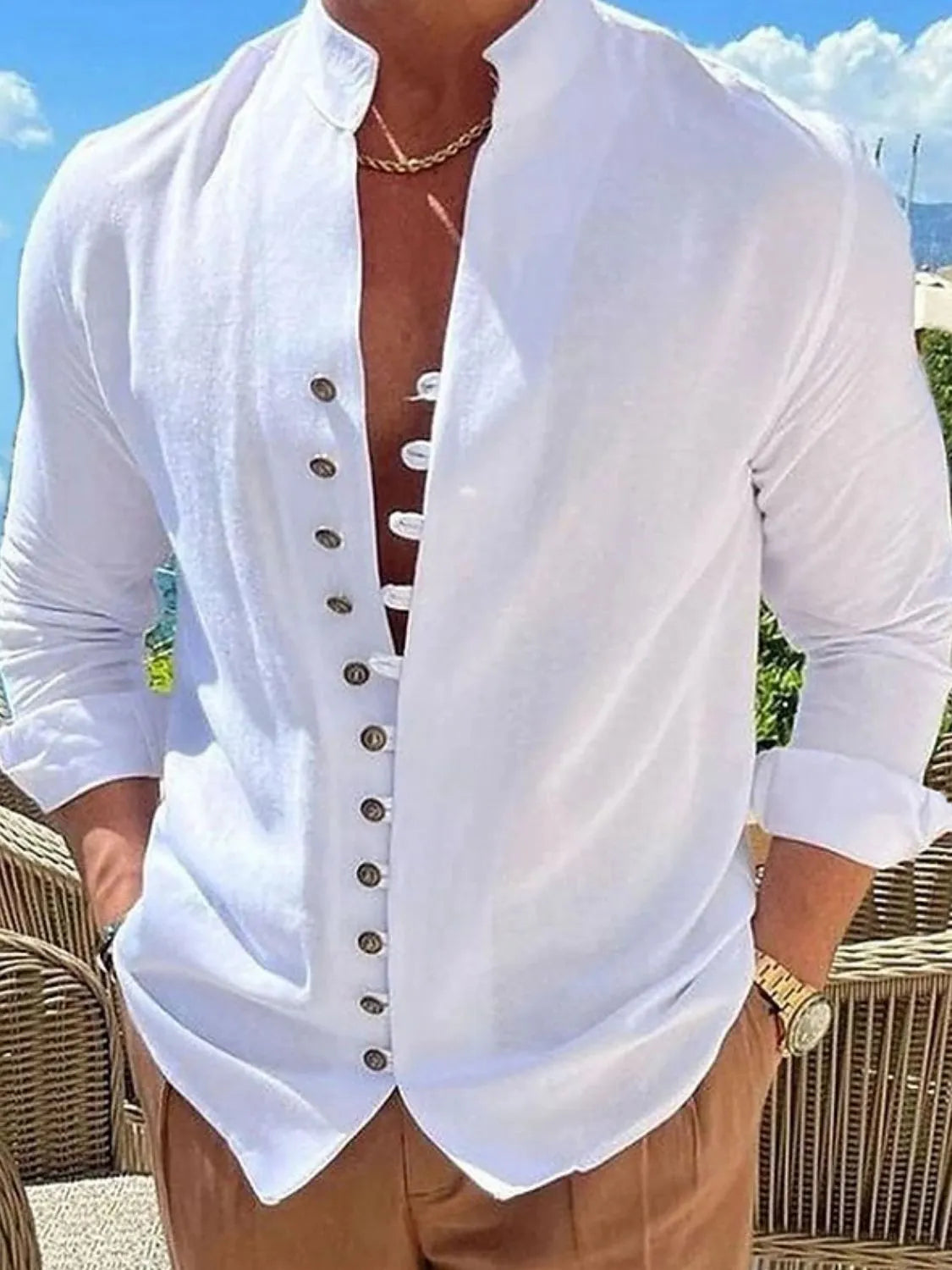 White linen shirt with mandarin collar and button placket, long sleeves.