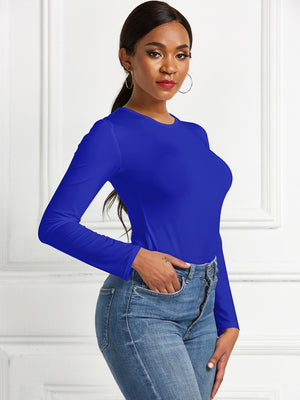 Royal Blue long sleeve ribbed bodysuit with crew neck, styled with jeans.