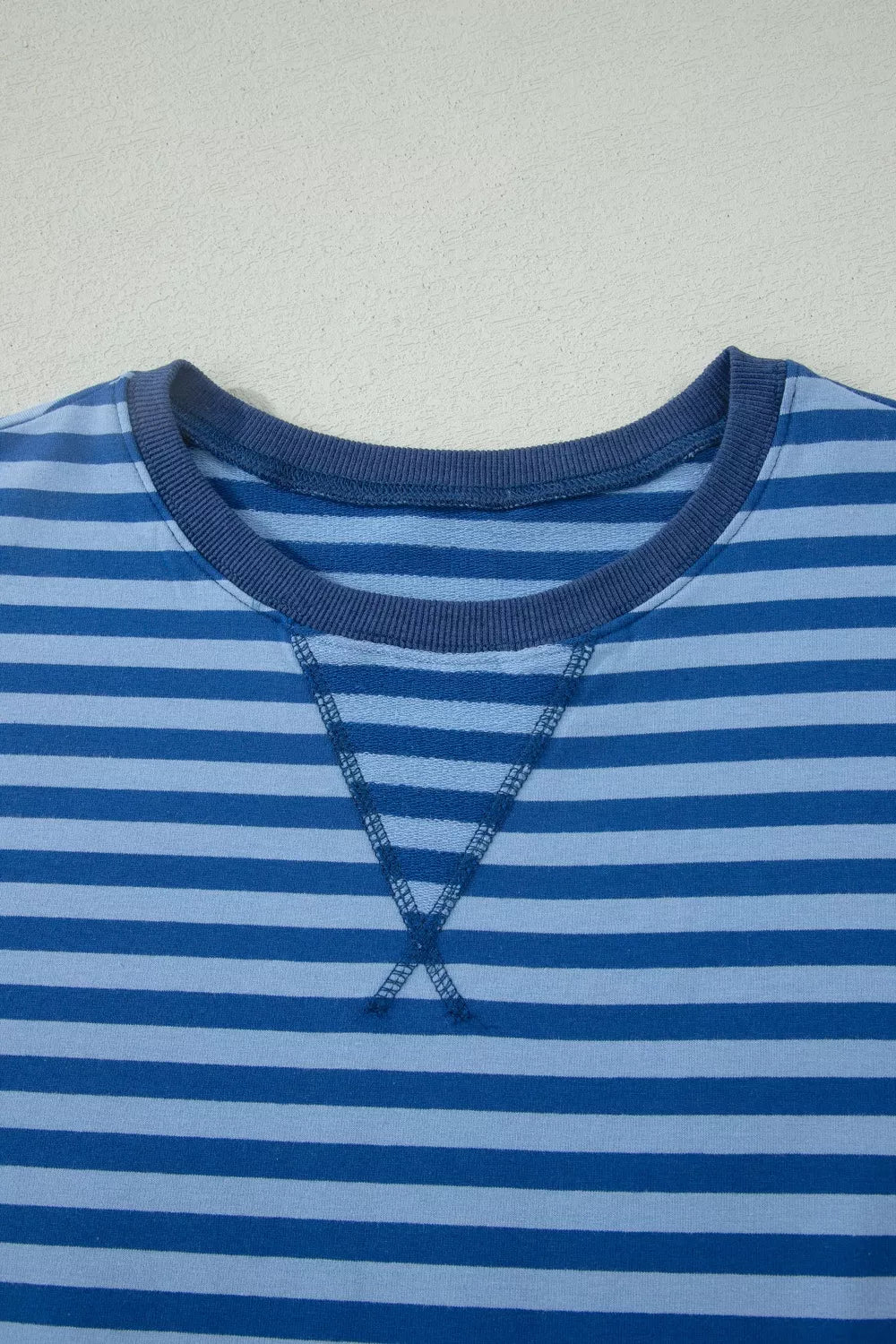 Blue striped cotton crew neck sweatshirt with contrast stitching detail.
