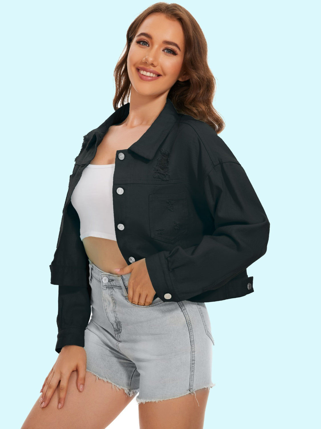 Black distressed denim trucker jacket with button front and frayed details