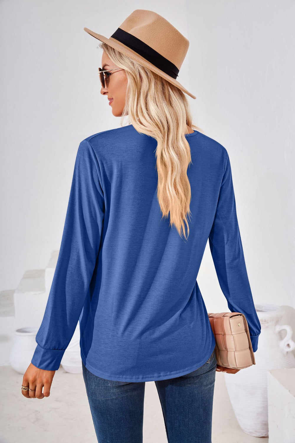 Royal blue jersey top with long sleeves and a gathered square neckline.